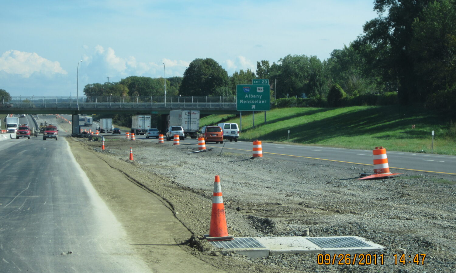 Highway construction zone; green sign indicates Albany, Rensselaer exits.