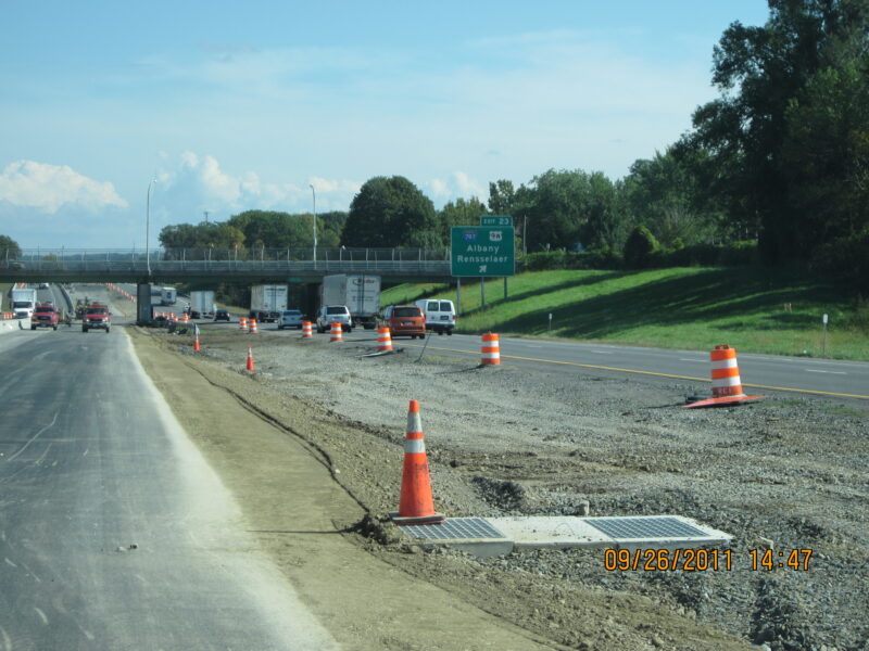 Highway construction zone; green sign indicates Albany, Rensselaer exits.